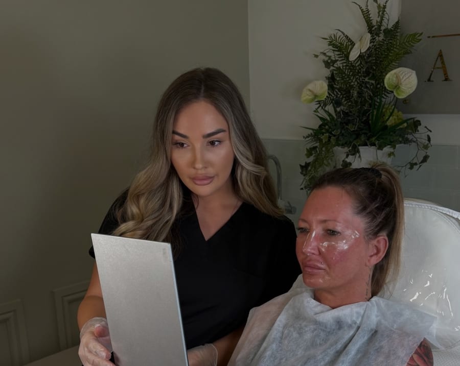 Angel discussing a result with a client in the clinic